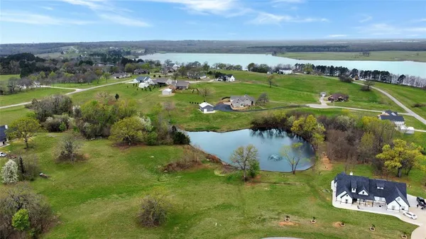 a view of a large body of water with a building in the background