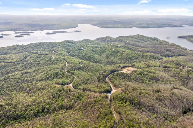 an aerial view of houses with beach