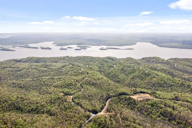 an aerial view of residential building and ocean view