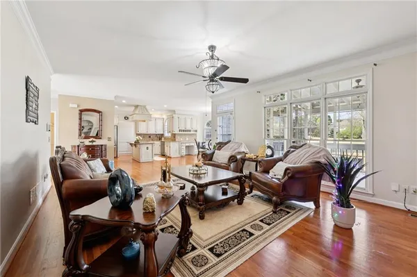 a kitchen with stainless steel appliances granite countertop a lot of counter space and wooden floor