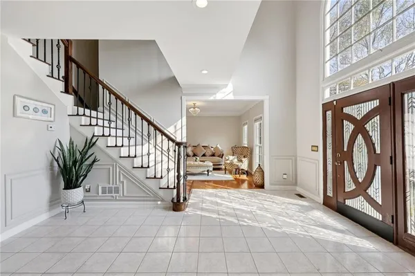 a living room with furniture fireplace and a flat screen tv