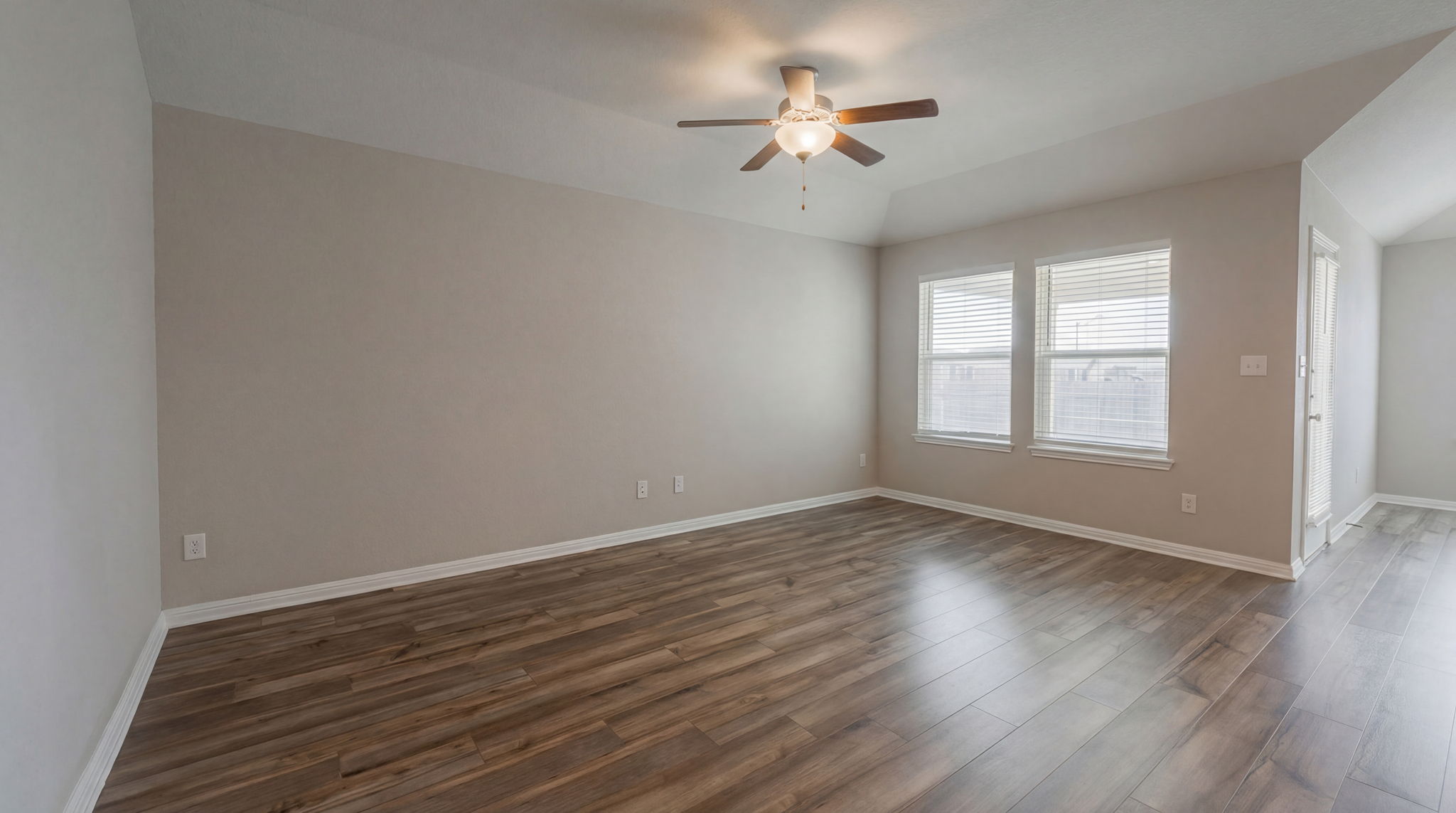 1003 Round Bale Road Hutto, TX 78634 - Photo 20 of 29 Spare room featuring dark wood-type flooring and a ceiling fan
