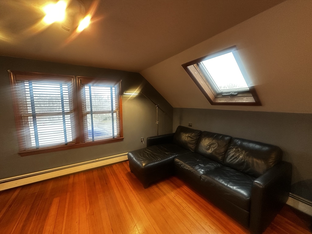1034 North Main Street, Unit 2 Randolph, MA 02368 - Photo 12 of 14 a living room with furniture and a hard wood floor