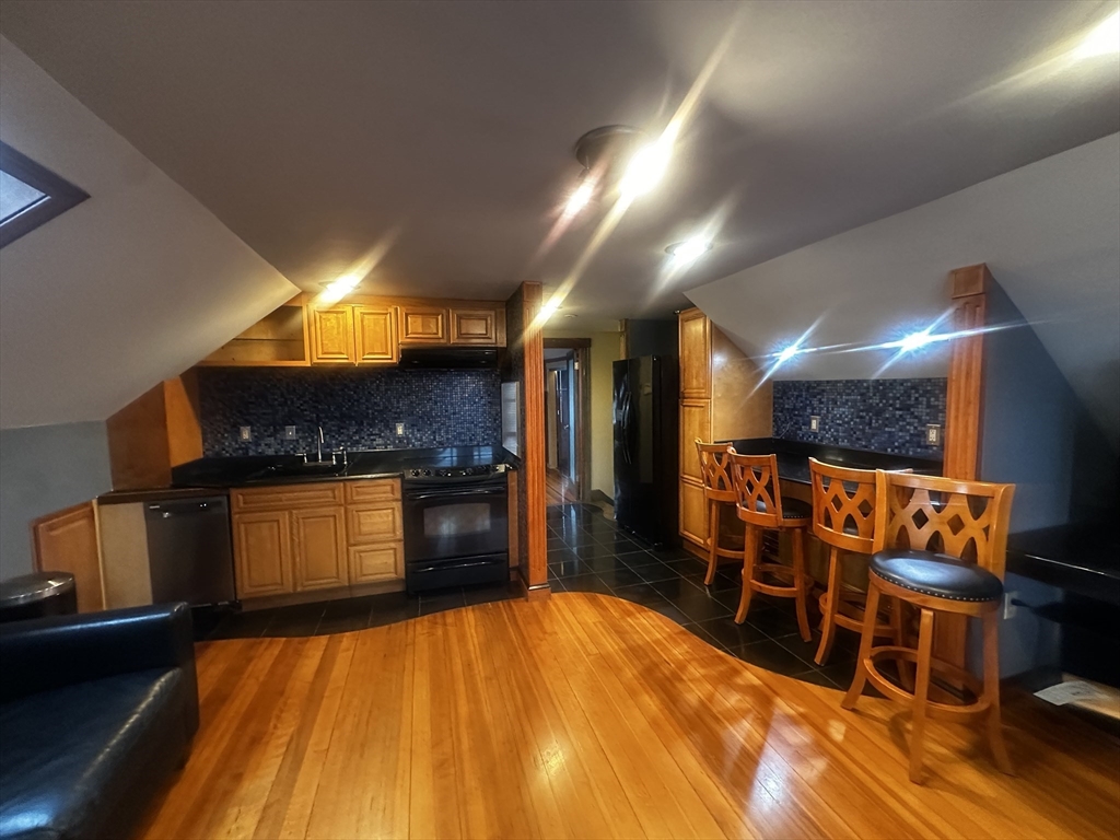 1034 North Main Street, Unit 2 Randolph, MA 02368 - Photo 13 of 14 a bathroom with a sink and a mirror