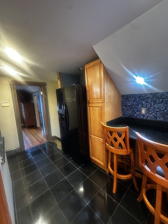 1034 North Main Street, Unit 2 Randolph, MA 02368 - Photo 10 of 14 a room with glass windows and furniture