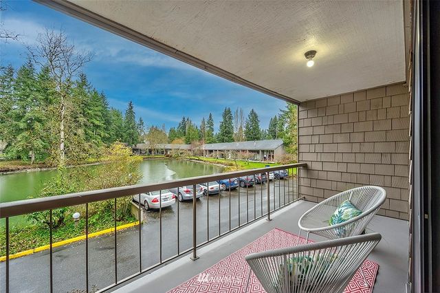 a view of balcony with furniture