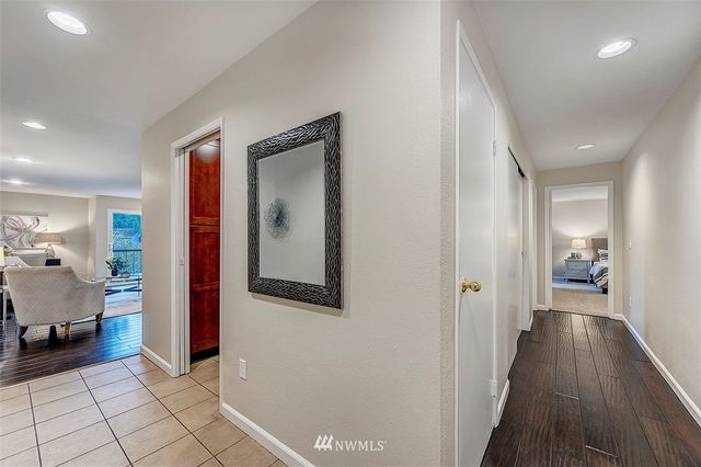 a view of a hallway with bathroom