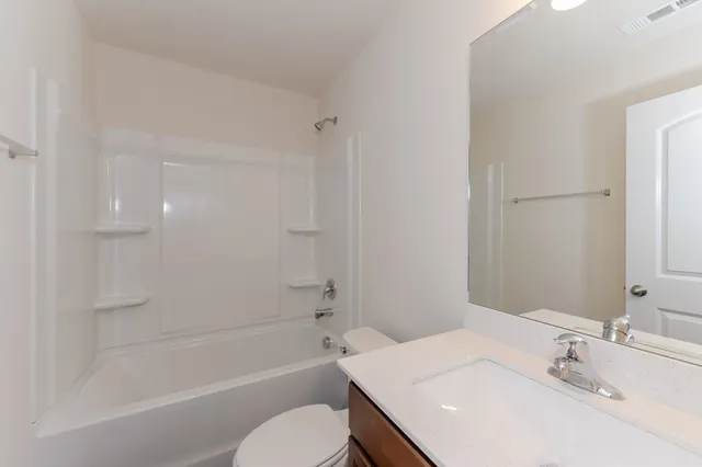 a bathroom with a sink toilet and bathtub