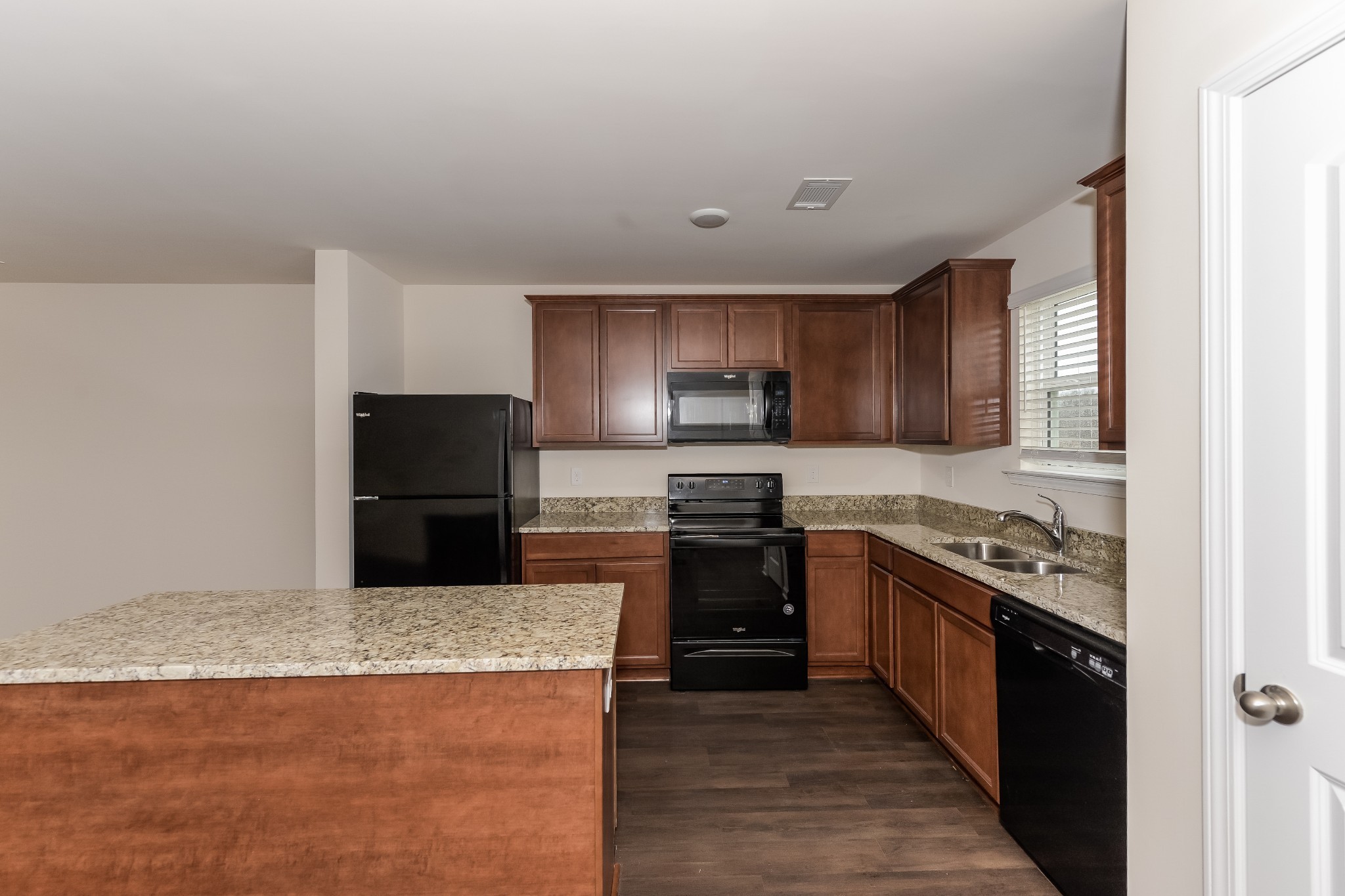 2714 Swarm Court Columbia, TN 38401 - Photo 5 of 17 a kitchen with stainless steel appliances granite countertop a stove a sink and a refrigerator