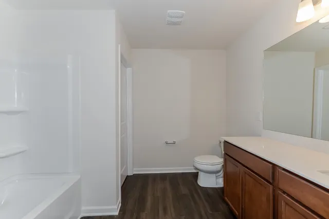 a bathroom with a sink a toilet and a bathtub