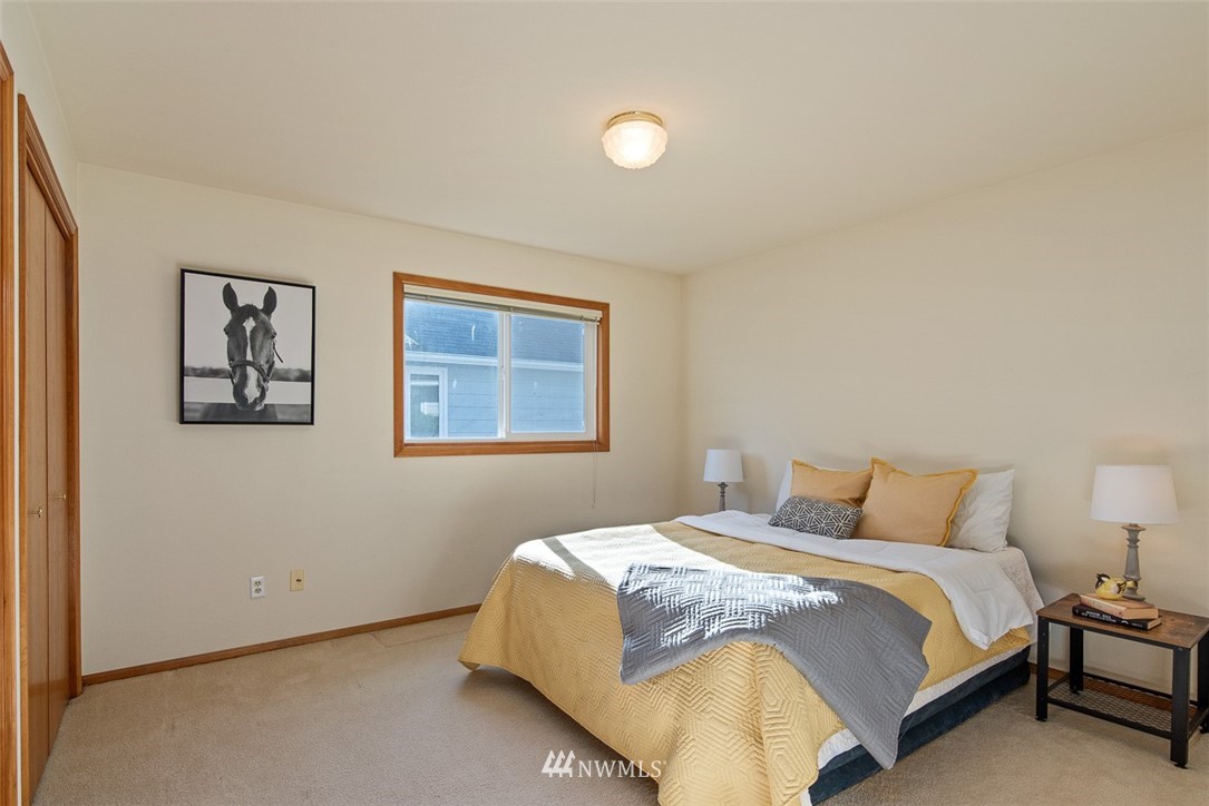 6852A Raspberry Dr., Unit B Everson, WA 98247 - Photo 17 of 25 a bedroom with a bed and wall painting