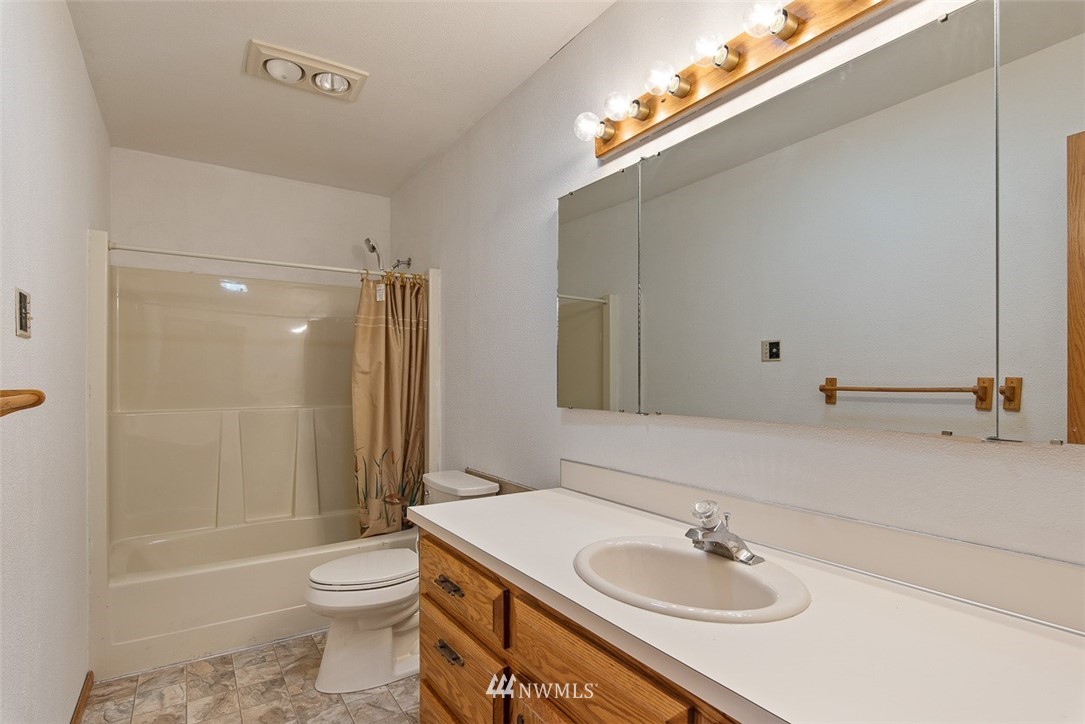 6852A Raspberry Dr., Unit B Everson, WA 98247 - Photo 18 of 25 a bathroom with a sink toilet and shower