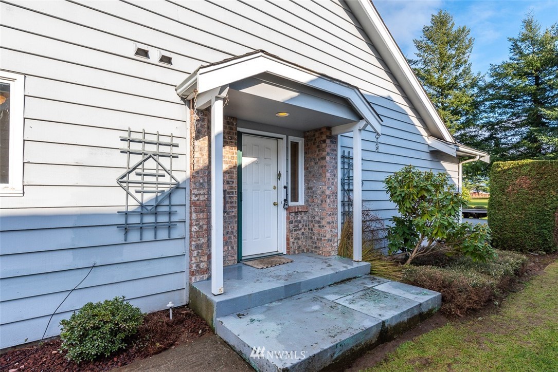 6852A Raspberry Dr., Unit B Everson, WA 98247 - Photo 2 of 25 a view of a house with a small garden