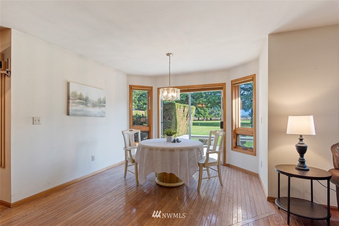 6852A Raspberry Dr., Unit B Everson, WA 98247 - Photo 6 of 25 a living room with furniture and a wooden floor
