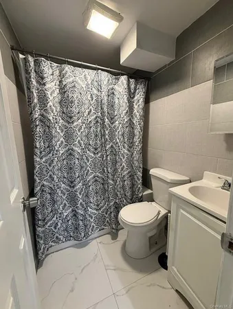 a bed room with a bed and dresser