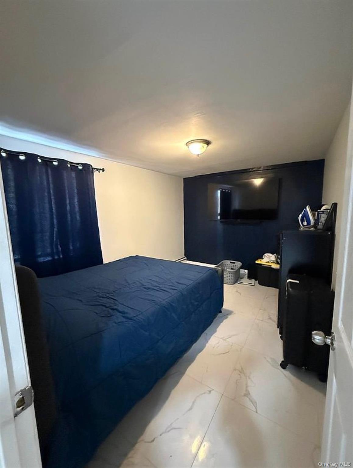 235-15 Bentley Road Queens, NY 11422 - Photo 5 of 17 a bed room with a bed and dresser