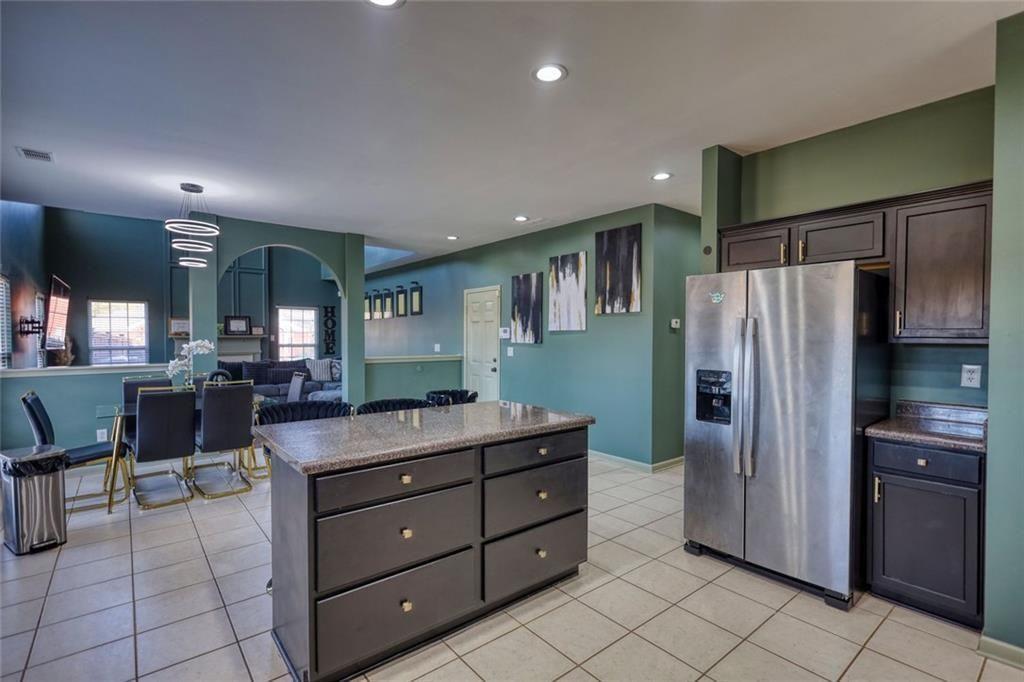 25 Caseys Way Covington, GA 30014 - Photo 15 of 33 a kitchen with stainless steel appliances granite countertop a refrigerator and a sink