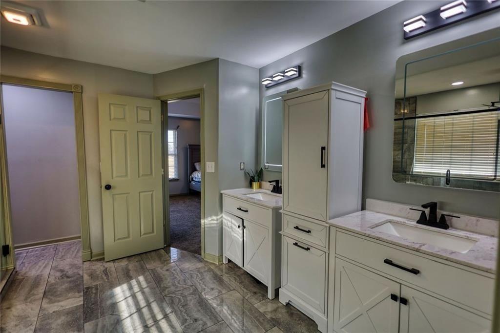 25 Caseys Way Covington, GA 30014 - Photo 24 of 33 a spacious bathroom with a double vanity sink mirror and shower