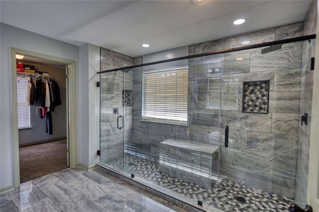 25 Caseys Way Covington, GA 30014 - Photo 25 of 33 a bathroom with a shower