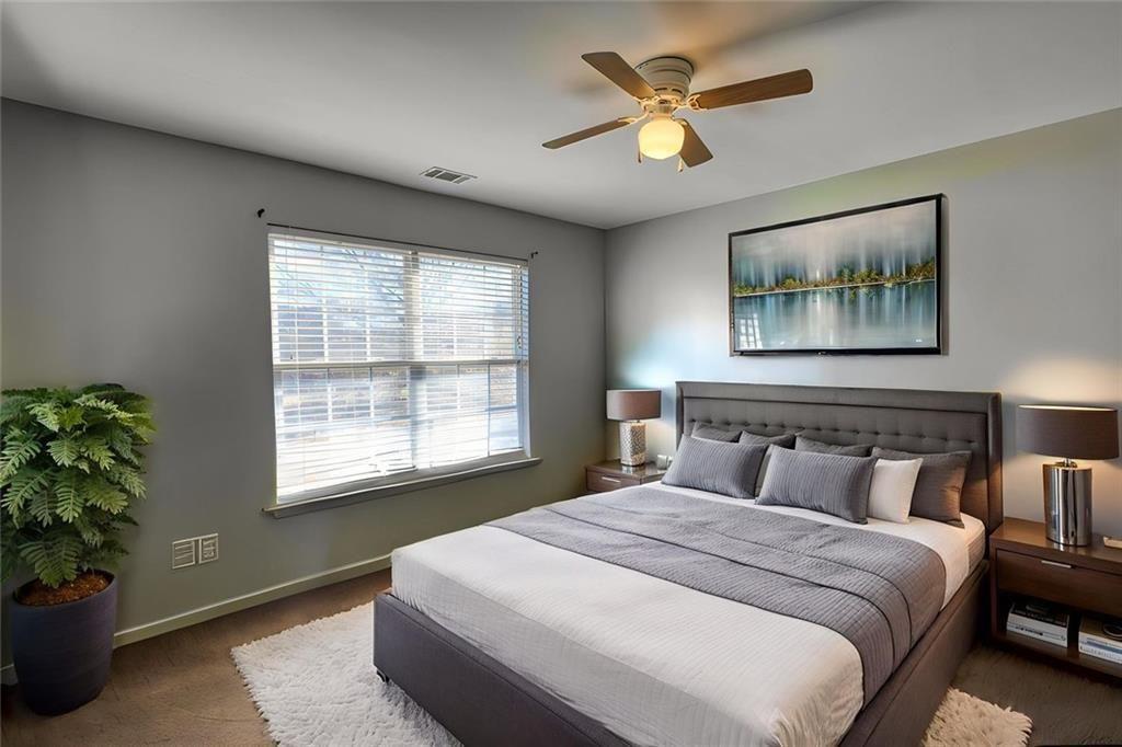 25 Caseys Way Covington, GA 30014 - Photo 27 of 33 a bedroom with a large bed and a potted plant