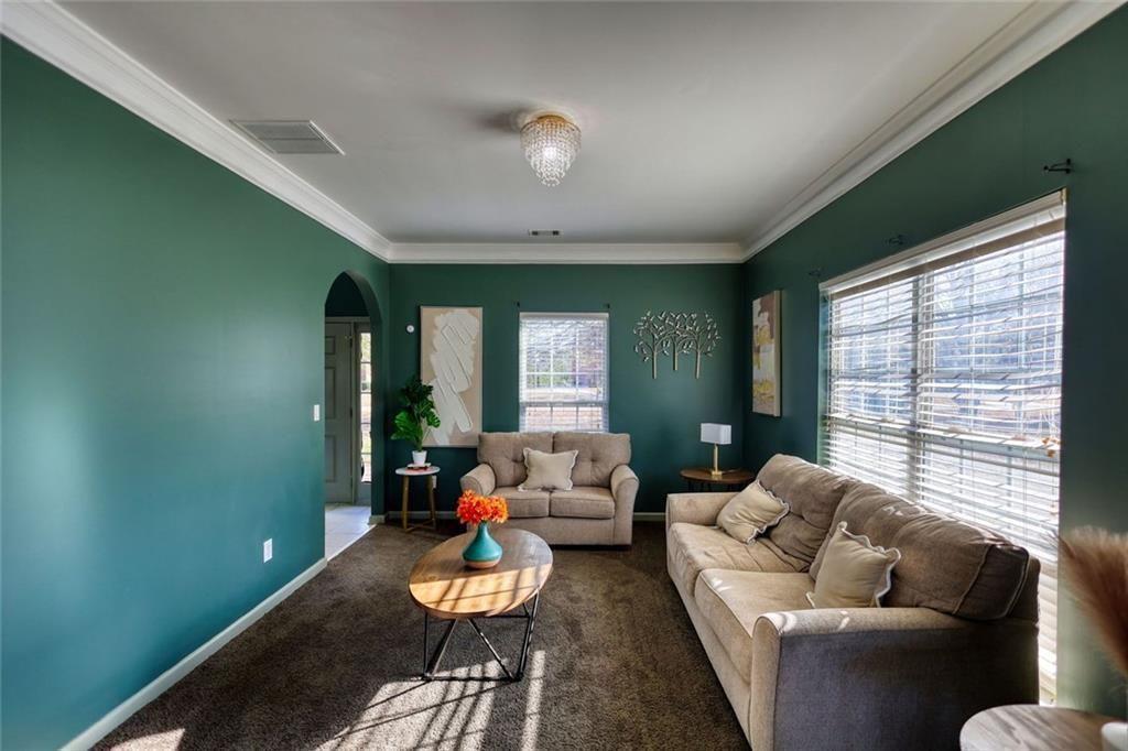 25 Caseys Way Covington, GA 30014 - Photo 9 of 33 a living room with furniture and a large window