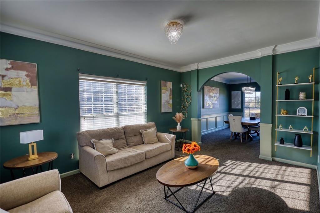 25 Caseys Way Covington, GA 30014 - Photo 10 of 33 a living room with furniture and a large window