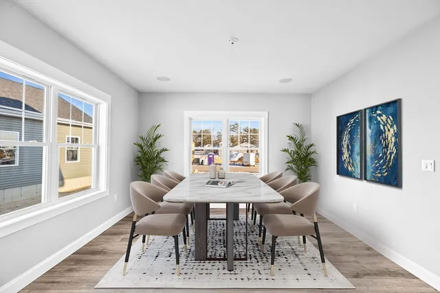 a dining room with furniture and window