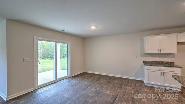 a view of a kitchen with a sink and a stove top oven