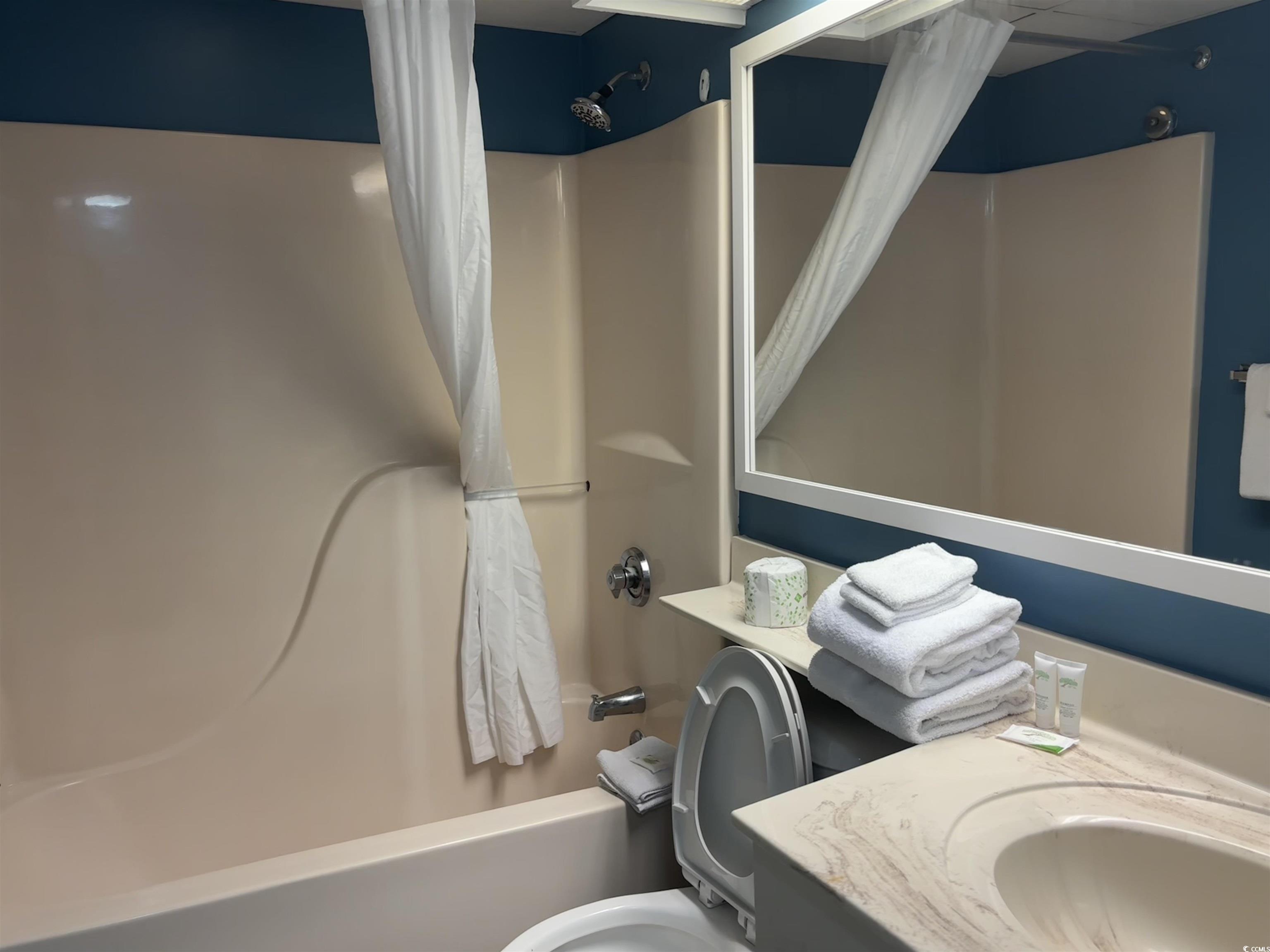 201N 74th Avenue North, Unit 2845/46 Myrtle Beach, SC 29572 - Photo 7 of 9 Bathroom featuring shower / bath combo with shower curtain and vanity