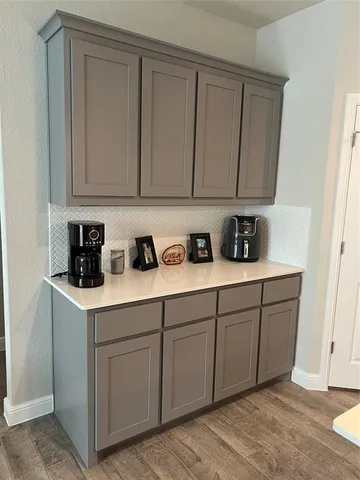 a kitchen with white cabinets
