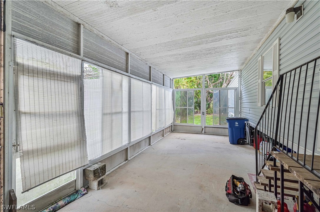 7461 Pinehurst Road Bokeelia, FL 33922 - Photo 25 of 25 a view of entryway with wooden floor