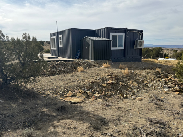 14183 High Mesa Loop Duchesne, UT 84021 - Photo 21 of 56 View of property exterior featuring board and batten siding and an ac unit