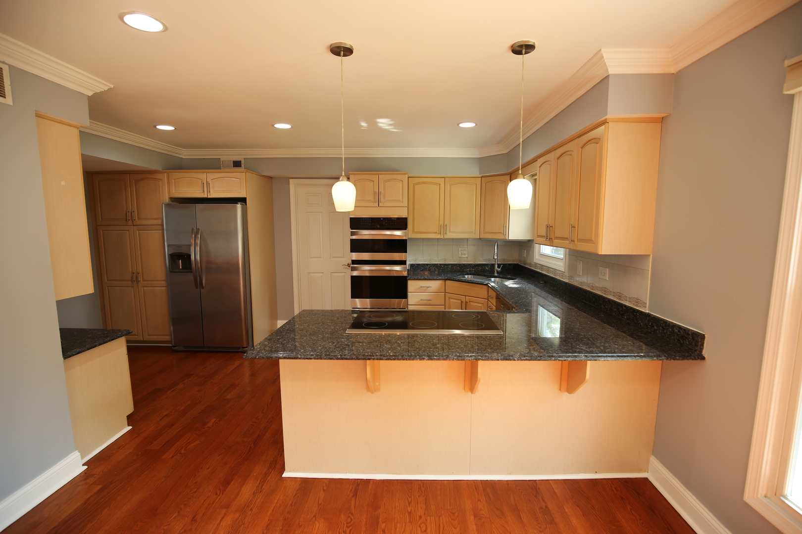 2603 Old Mill Lane Rolling Meadows, IL 60008 - Photo 11 of 45 a view of a kitchen with a sink and wooden floor