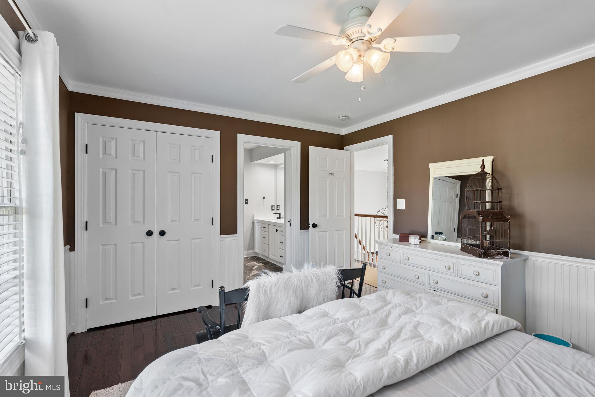 7 Redtree Lane Reisterstown, MD 21136 - Photo 43 of 56 a bedroom with a bed and a chandelier