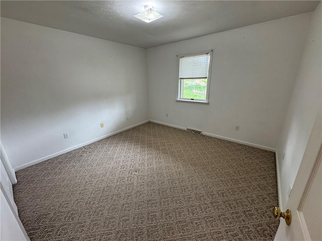 208 Pats Drive Rostraver Township, PA 15012 - Photo 13 of 50 an empty room with a window