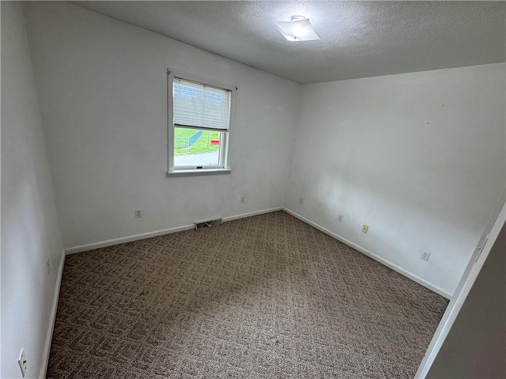 208 Pats Drive Rostraver Township, PA 15012 - Photo 15 of 50 an empty room with a window