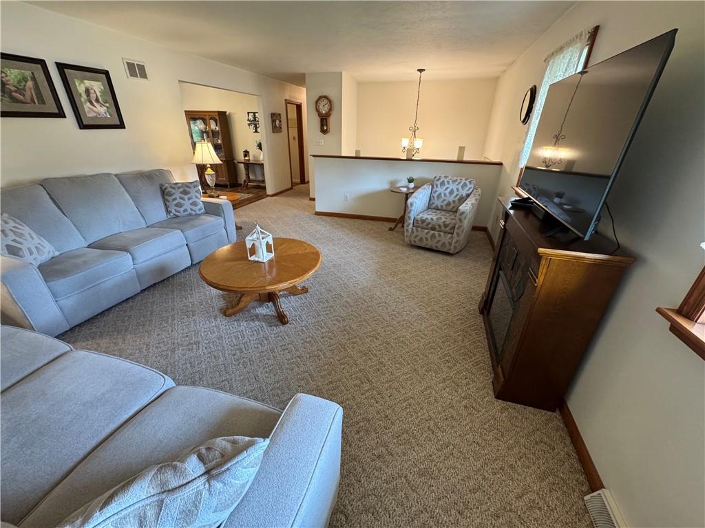 208 Pats Drive Rostraver Township, PA 15012 - Photo 16 of 50 a living room with furniture and a flat screen tv