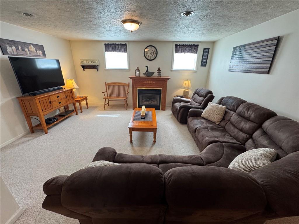 208 Pats Drive Rostraver Township, PA 15012 - Photo 17 of 50 a living room with furniture and a flat screen tv