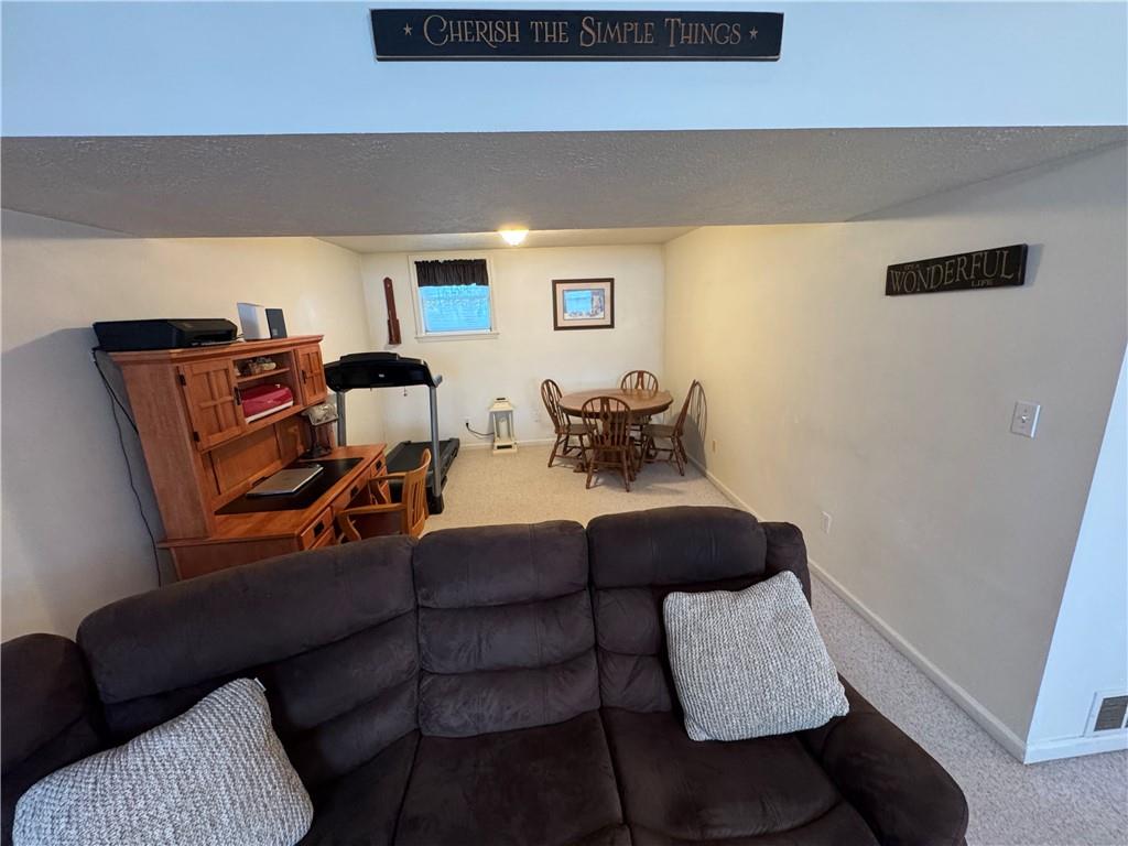 208 Pats Drive Rostraver Township, PA 15012 - Photo 19 of 50 a living room with furniture and a window