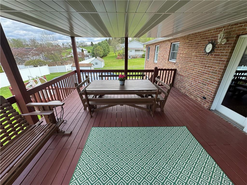 208 Pats Drive Rostraver Township, PA 15012 - Photo 21 of 50 a view of a roof deck with wooden floor and fence