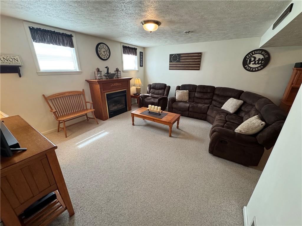 208 Pats Drive Rostraver Township, PA 15012 - Photo 26 of 50 a living room with furniture and a large window