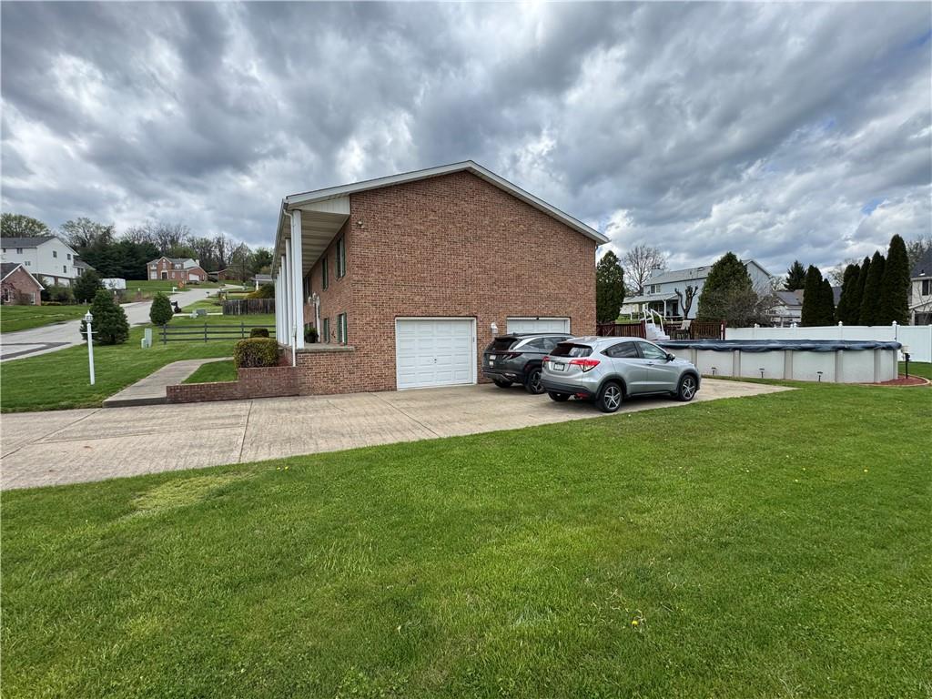 208 Pats Drive Rostraver Township, PA 15012 - Photo 34 of 50 a car parked in front of the house