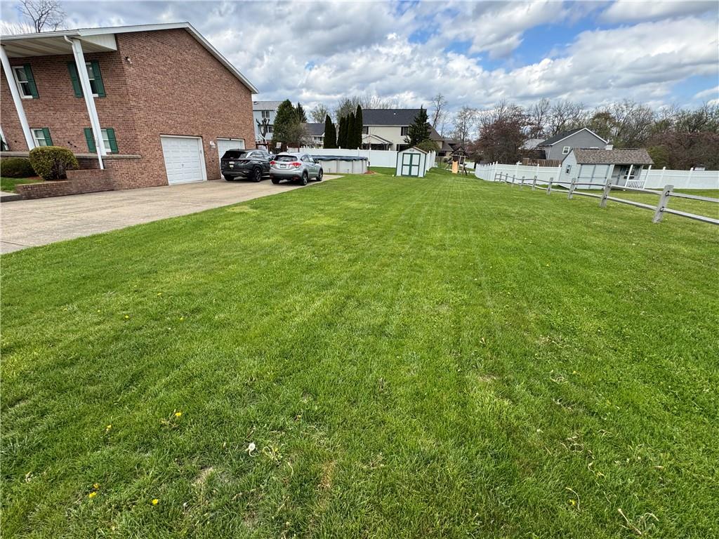 208 Pats Drive Rostraver Township, PA 15012 - Photo 35 of 50 a view of a patio with table and chairs and potted plants