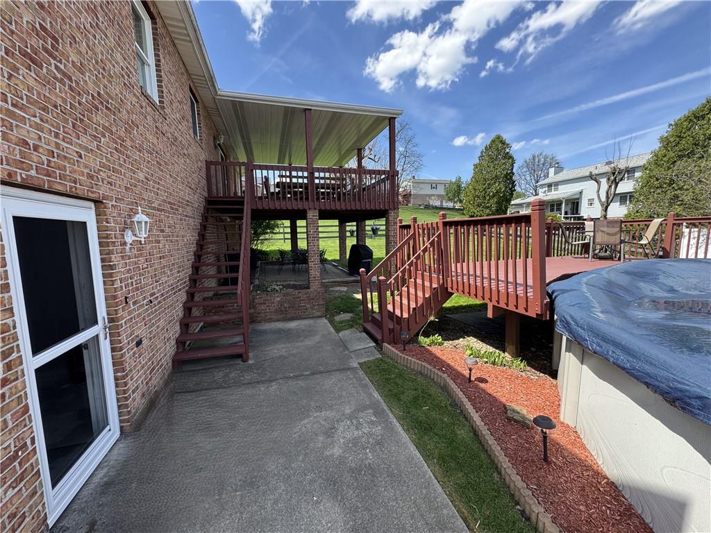 208 Pats Drive Rostraver Township, PA 15012 - Photo 36 of 50 a view of a porch with wooden floor and iron fence