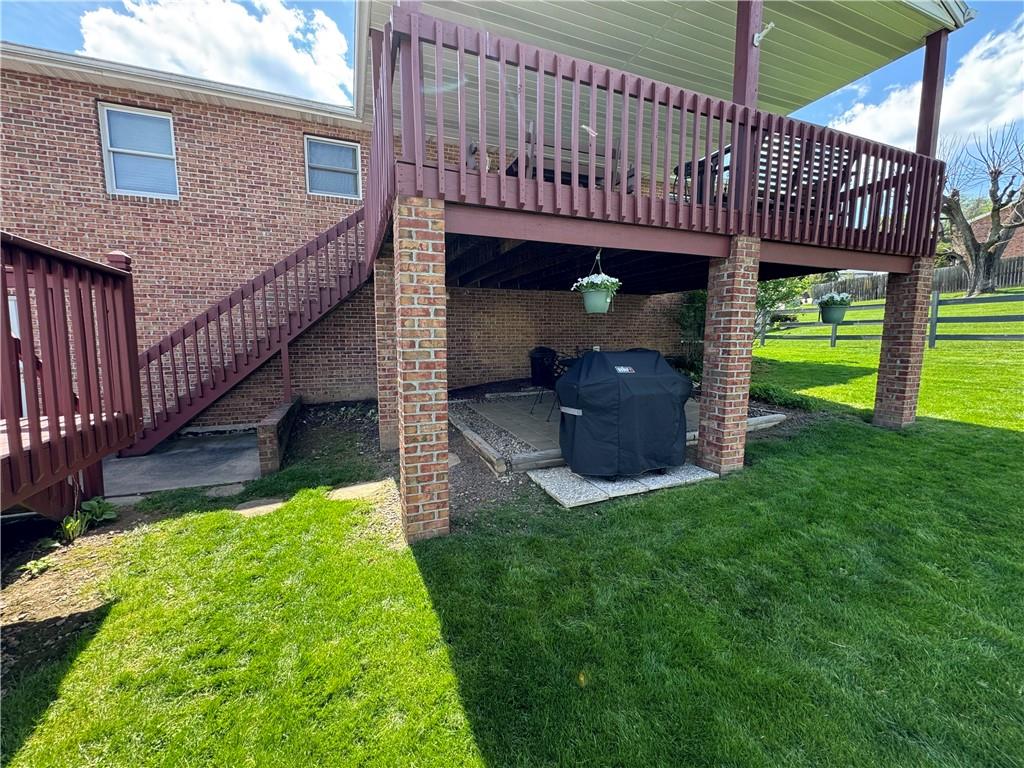 208 Pats Drive Rostraver Township, PA 15012 - Photo 37 of 50 a view of a house with a yard potted plants and a large tree