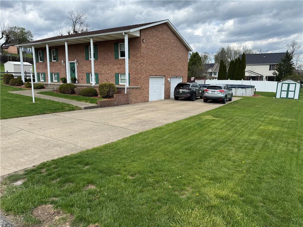 208 Pats Drive Rostraver Township, PA 15012 - Photo 49 of 50 a car parked in front of house
