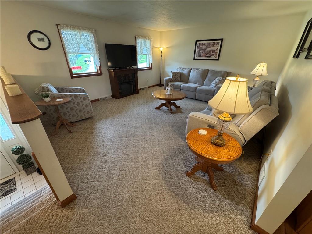 208 Pats Drive Rostraver Township, PA 15012 - Photo 7 of 50 a living room with furniture and a mirror