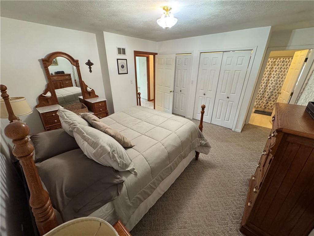 208 Pats Drive Rostraver Township, PA 15012 - Photo 9 of 50 a bed room with a bed and a couch