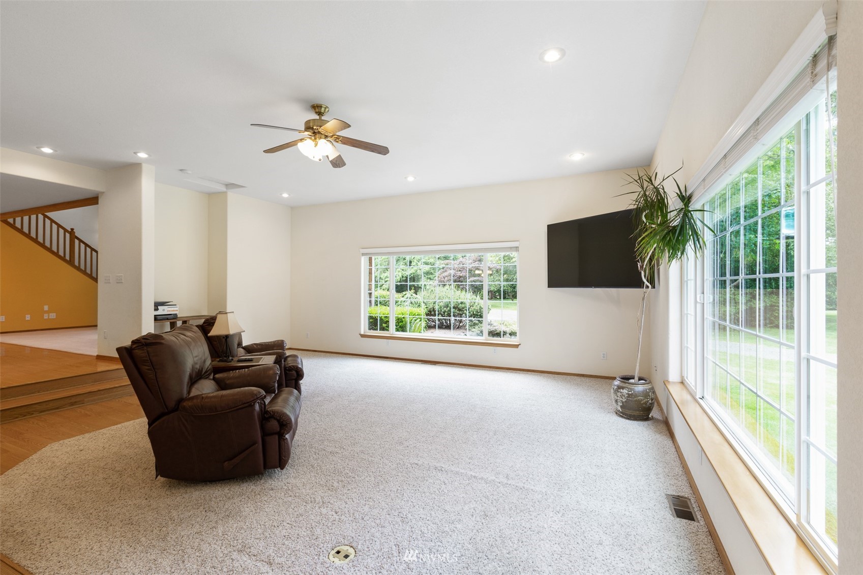 257 Riverside Road Sequim, WA 98382 - Photo 16 of 40 a living room with furniture and a flat screen tv