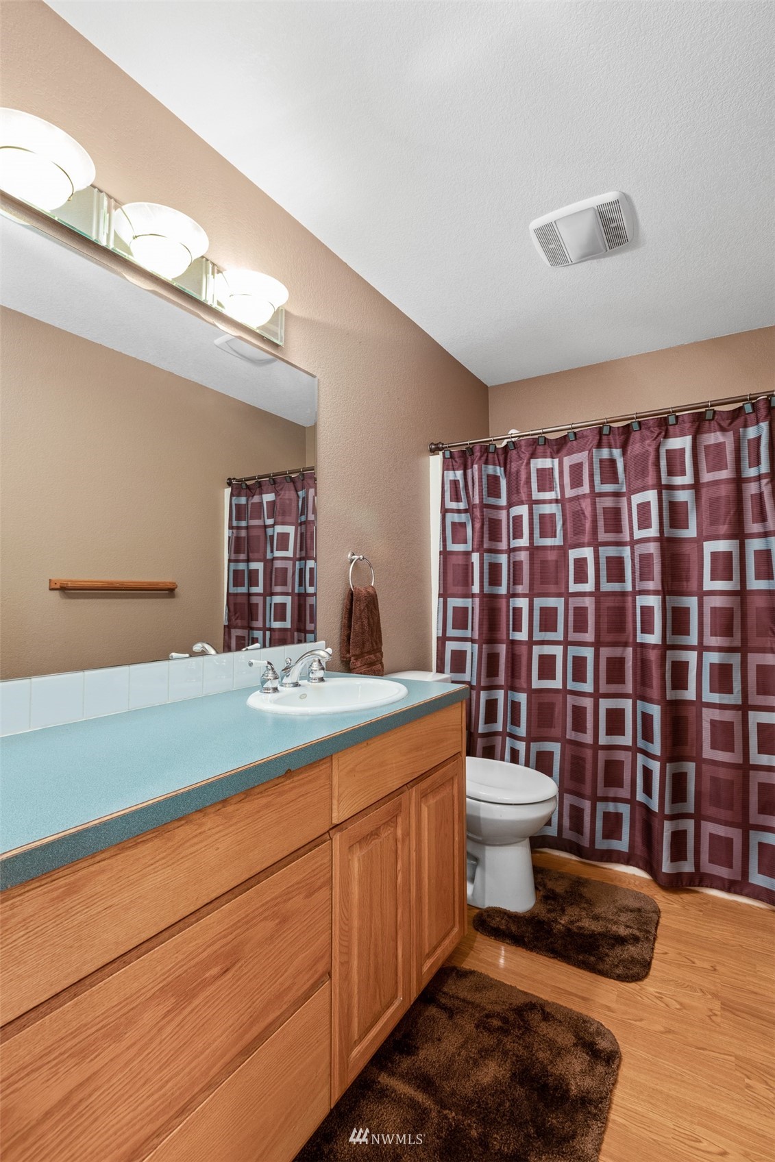 257 Riverside Road Sequim, WA 98382 - Photo 20 of 40 a bathroom with a sink a toilet and shower